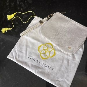 Kendra Scott clutch white with gold trim. Only carried a couple of times.